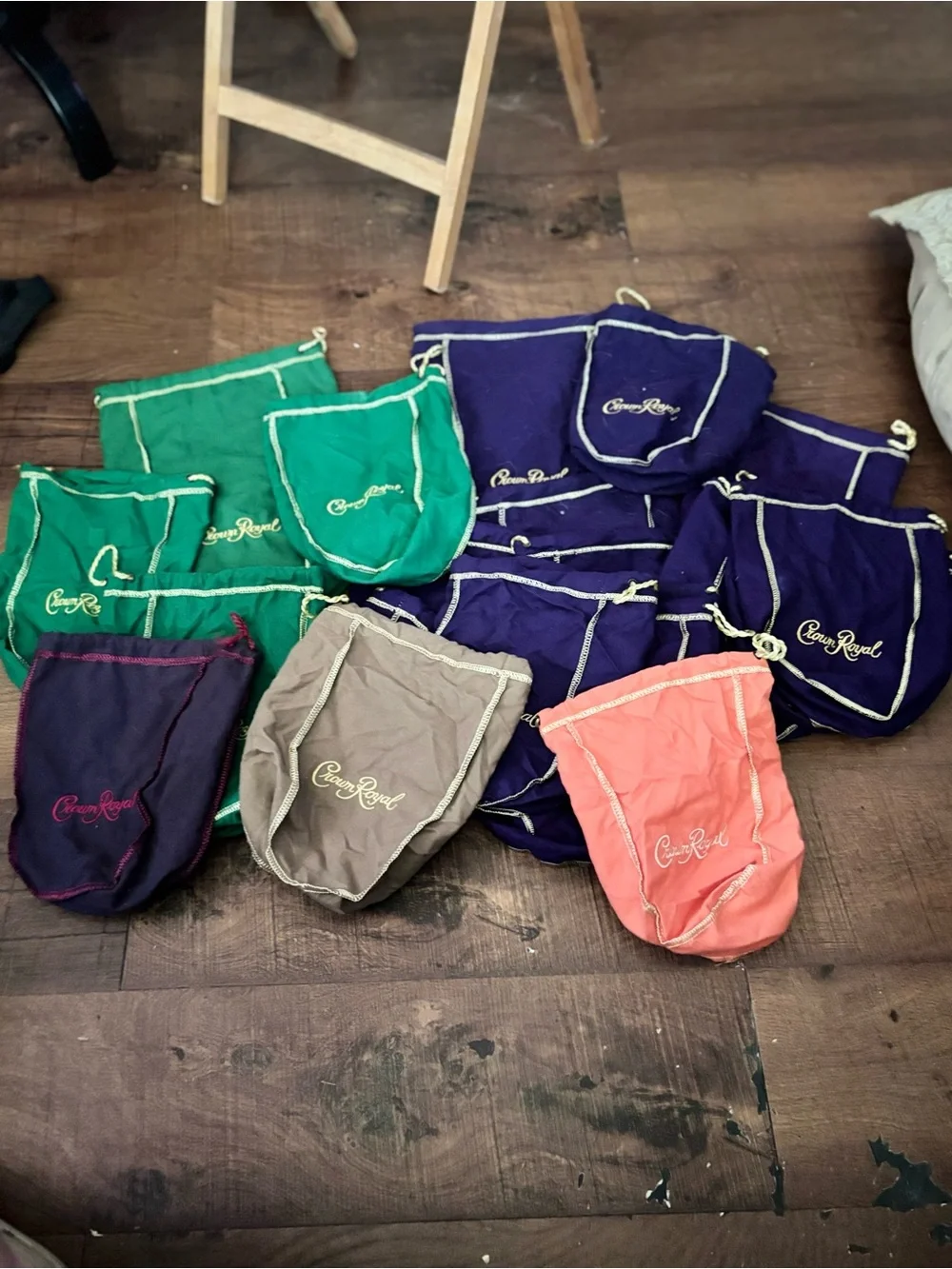 Crown Royal Bags. 1 lg 12 sm Purple, 1 lg 3 sm Green, 1 navy, 1 Vanilla, 1Peach